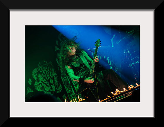 "Person Playing Guitar on Stage With Light Ray", Thibault Trillet