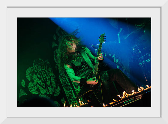 "Person Playing Guitar on Stage With Light Ray", Thibault Trillet