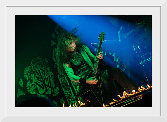 "Person Playing Guitar on Stage With Light Ray", Thibault Trillet