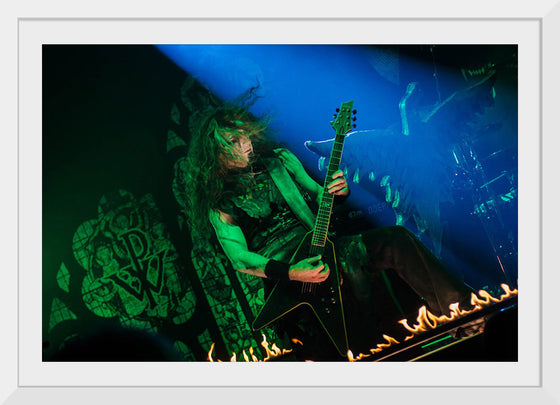 "Person Playing Guitar on Stage With Light Ray", Thibault Trillet