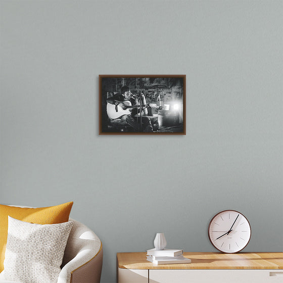 "Man in Studio with Guitar"