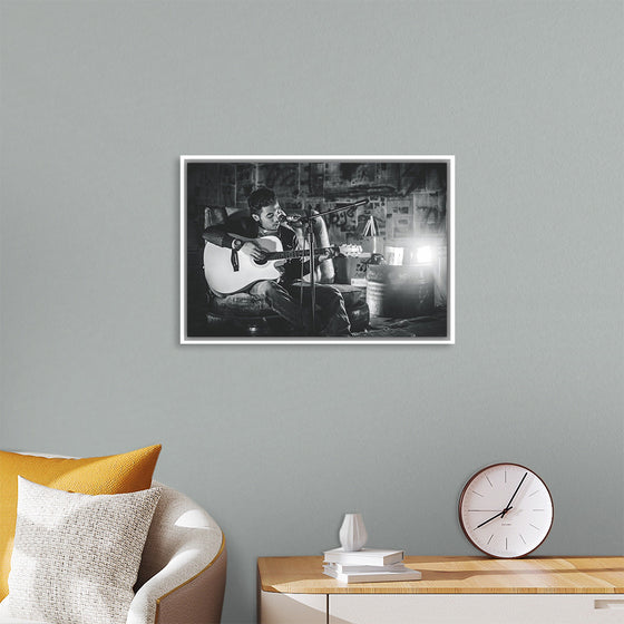 "Man in Studio with Guitar"