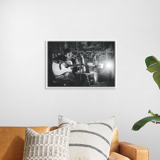 "Man in Studio with Guitar"