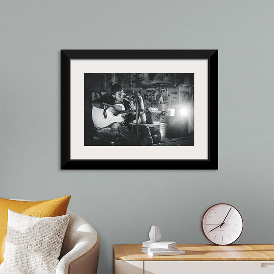 "Man in Studio with Guitar"