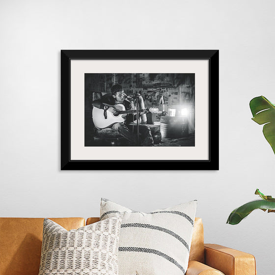 "Man in Studio with Guitar"