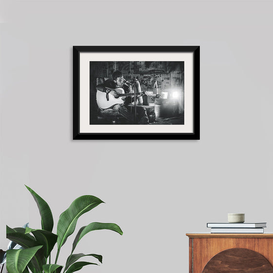 "Man in Studio with Guitar"