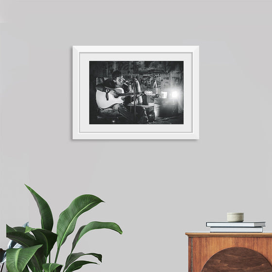 "Man in Studio with Guitar"