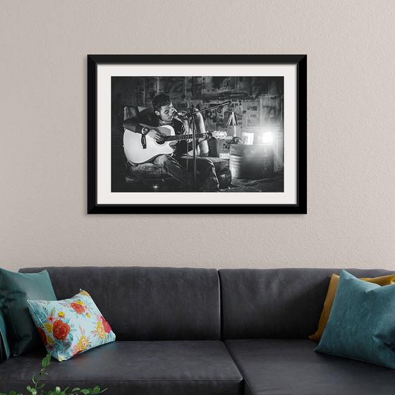 "Man in Studio with Guitar"