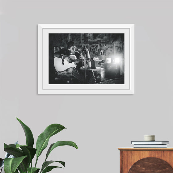 "Man in Studio with Guitar"