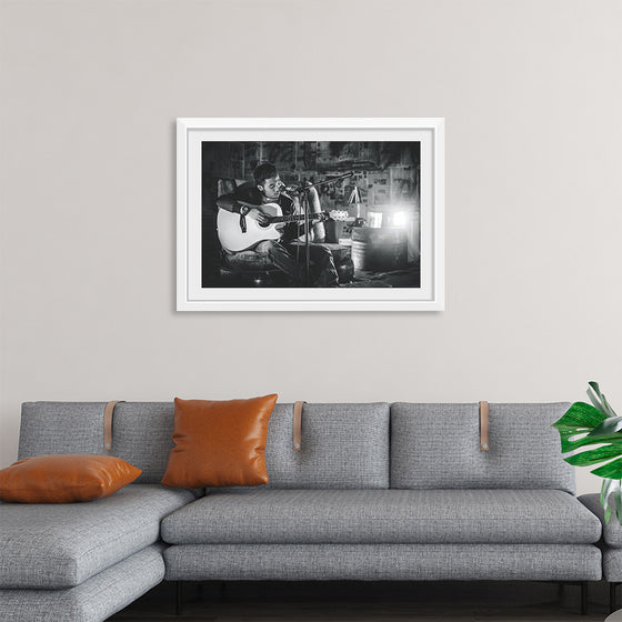 "Man in Studio with Guitar"