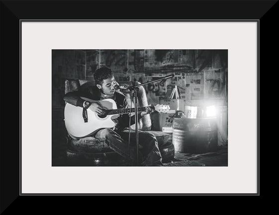 "Man in Studio with Guitar"