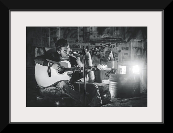 "Man in Studio with Guitar"