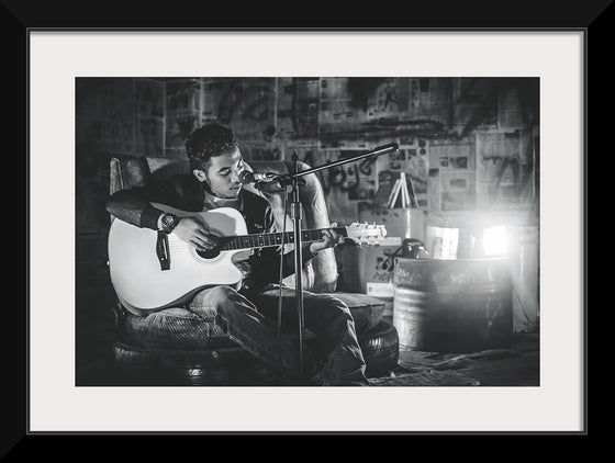 "Man in Studio with Guitar"