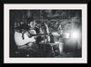 "Man in Studio with Guitar"