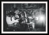 "Man in Studio with Guitar"