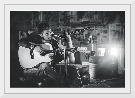 "Man in Studio with Guitar"