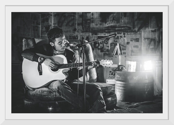 "Man in Studio with Guitar"