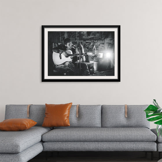 "Man in Studio with Guitar"