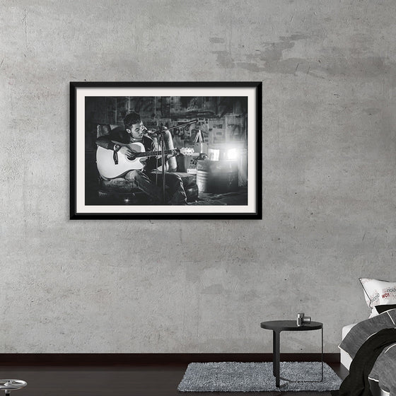 "Man in Studio with Guitar"