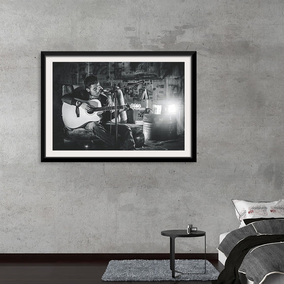 "Man in Studio with Guitar"