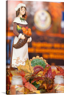  This artwork is a captivating print that beautifully captures the enchanting aura of autumn. The meticulously crafted figurine, adorned in a classic attire, tenderly holds a basket brimming with the season’s bountiful harvest. The backdrop, a symphony of vibrant fall leaves and an intricately designed fan, evokes a sense of warmth and nostalgia.