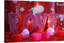 This artwork is a radiant expression of love, captured in the warm glow of heart-shaped and cylindrical candles. The glittering “LOVE” letters, set against a backdrop adorned with whimsical floral designs and illuminated by enchanting fairy lights, create a romantic ambiance. This print isn’t just a piece of art; it’s an experience of affection and warmth. 