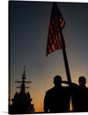 This evocative print captures a poignant moment of honor, duty, and patriotism. The silhouette of service members saluting the American flag against the backdrop of a serene sunset is a powerful image. The naval ship in the distance adds a layer of depth and intrigue. This artwork invokes feelings of gratitude and admiration for those who serve, making it a meaningful addition to any collection.