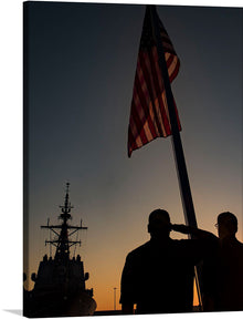  This evocative print captures a poignant moment of honor, duty, and patriotism. The silhouette of service members saluting the American flag against the backdrop of a serene sunset is a powerful image. The naval ship in the distance adds a layer of depth and intrigue. This artwork invokes feelings of gratitude and admiration for those who serve, making it a meaningful addition to any collection.