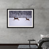 "Two white-tailed deer run through the snow"