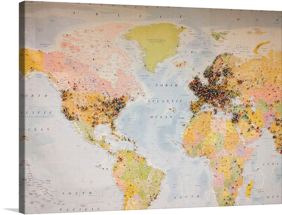 “Pinned World Map”. This artwork is a captivating portrayal of the world that promises to bring a touch of elegance and functionality to any space. The map is highly detailed with geographical information, outlining and labeling countries and oceans in muted tones. The colorful pins, concentrated in Europe, North America, and parts of Asia, indicate visited places or points of interest. The color palette is diverse due to the multitude of pin colors against the muted tones of the map. 