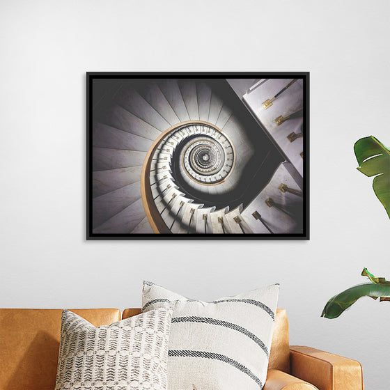 "Impressive View Down a Stairwell With Spiral Marble Stairs"