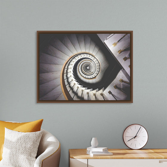 "Impressive View Down a Stairwell With Spiral Marble Stairs"