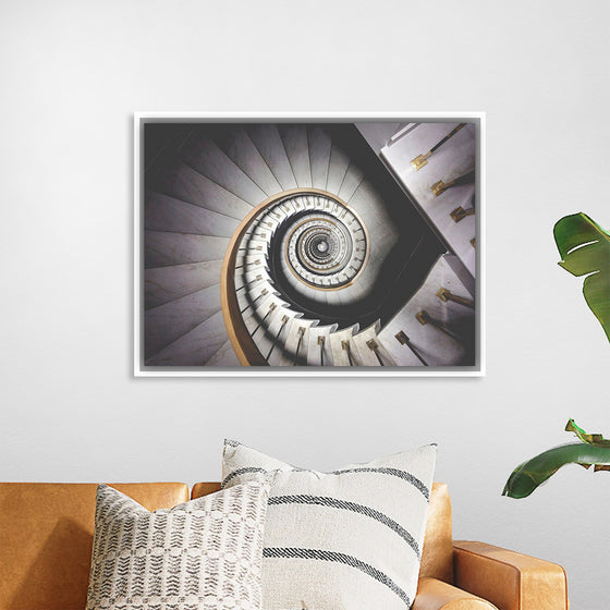 "Impressive View Down a Stairwell With Spiral Marble Stairs"