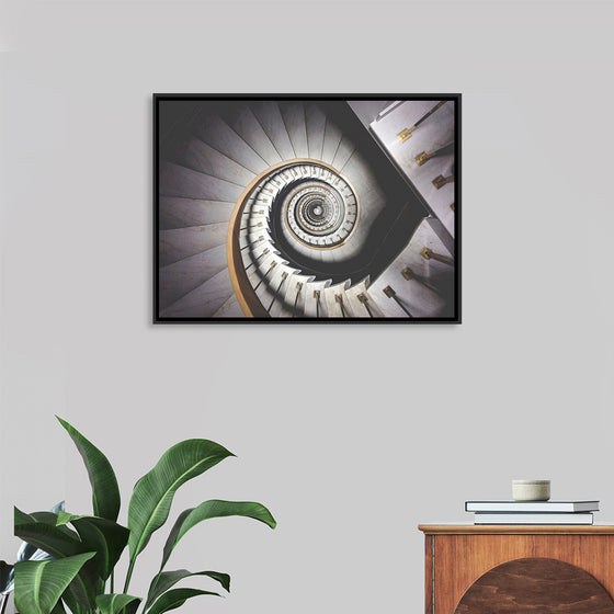 "Impressive View Down a Stairwell With Spiral Marble Stairs"