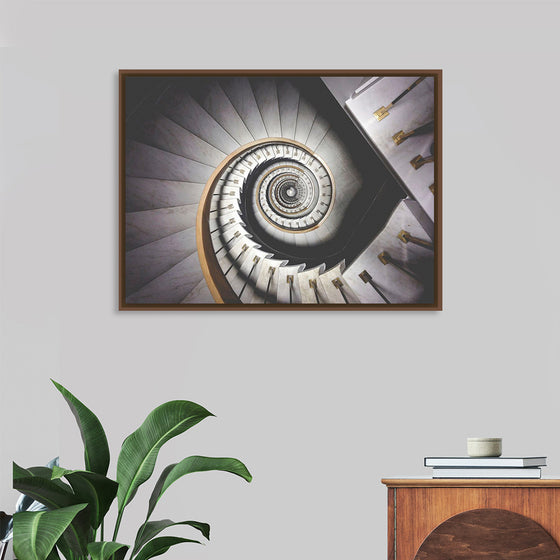 "Impressive View Down a Stairwell With Spiral Marble Stairs"