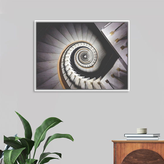 "Impressive View Down a Stairwell With Spiral Marble Stairs"