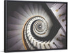 "Impressive View Down a Stairwell With Spiral Marble Stairs"