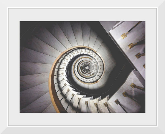 "Impressive View Down a Stairwell With Spiral Marble Stairs"