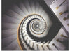 "Impressive View Down a Stairwell With Spiral Marble Stairs"