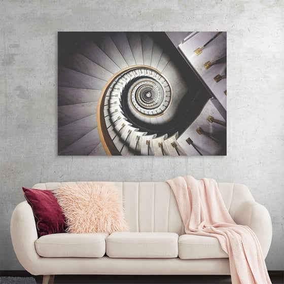 "Impressive View Down a Stairwell With Spiral Marble Stairs"