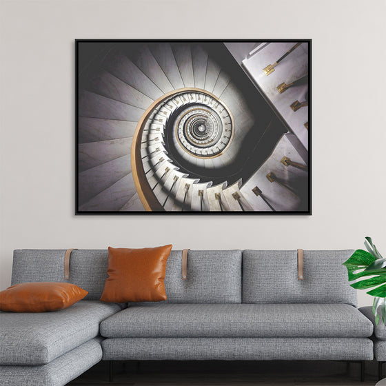 "Impressive View Down a Stairwell With Spiral Marble Stairs"