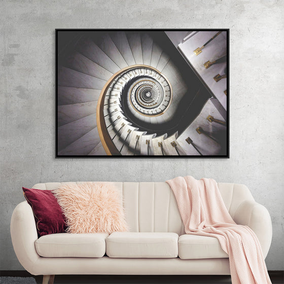 "Impressive View Down a Stairwell With Spiral Marble Stairs"