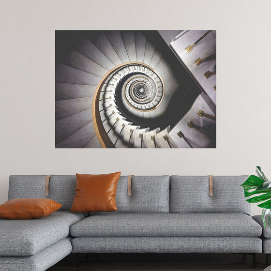 "Impressive View Down a Stairwell With Spiral Marble Stairs"