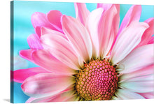 Immerse yourself in the enchanting allure of “Pink Daisy”. This exquisite print captures the ethereal beauty of a blooming daisy, with petals painted in mesmerizing hues of pink and white that seem to dance against a serene turquoise backdrop. Every intricate detail, from the delicate petals to the intricately patterned core, is brought to life with stunning clarity. 