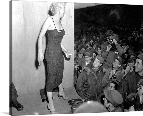 Step back in time with this captivating print capturing a moment of vintage glamour and allure. The artwork showcases Marilyn Monroe, the epitome of elegance, adorned in a classic black dress that hugs her figure gracefully. She stands amidst an audience of photographers, their cameras poised to capture her radiant beauty.