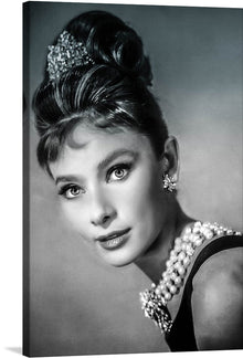  This iconic black and white photograph of Audrey Hepburn as Holly Golightly in Breakfast at Tiffany's is a must-have for any fan of classic cinema or timeless beauty. The image captures Hepburn at her most elegant and sophisticated, with her signature hairstyle and little black dress. Her gaze is both wistful and hopeful, reflecting the complex and intriguing character of Holly Golightly.