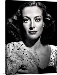  “Joan Crawford” is a timeless piece of art that captures the essence of classic glamour and sophistication. The artwork features a woman whose face is obscured for privacy reasons, wearing an exquisite polka-dotted blouse or dress. The intricate patterns on her attire and the graceful poise of her posture are captured with artistic mastery.