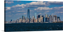  Immerse yourself in the breathtaking view of a city that never sleeps with this exquisite print. The artwork captures the iconic New York City skyline, where architectural marvels stand tall against the backdrop of a clear blue sky, punctuated by fluffy white clouds. The tranquil waters of the Hudson River add a serene touch to the bustling cityscape, offering a harmonious blend of urban life and natural beauty. 
