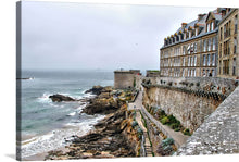  “Saint Malo France” is a captivating artwork that captures the timeless elegance and romantic allure of this iconic coastal town. The painting features a row of elegant buildings with classic architecture lining the top right side, their stately presence accentuated by numerous windows and steep roofs. 