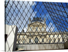  “The Louvre” beckons you into a world where art and history intertwine. This captivating print captures the iconic Parisian museum, its timeless facade juxtaposed against the modern elegance of the glass pyramid entrance. The intricate geometric patterns of the pyramid draw you in, while the majestic Louvre stands as a testament to centuries of creativity. 
